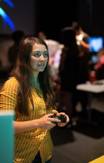 Person holding video game console