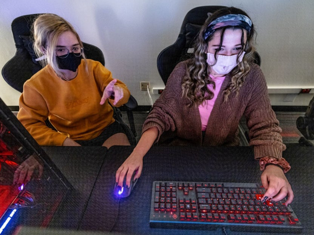 two girls gaming in an esports room
