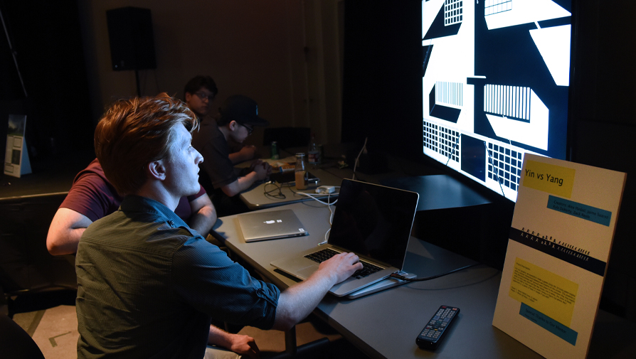 students working on a desktop