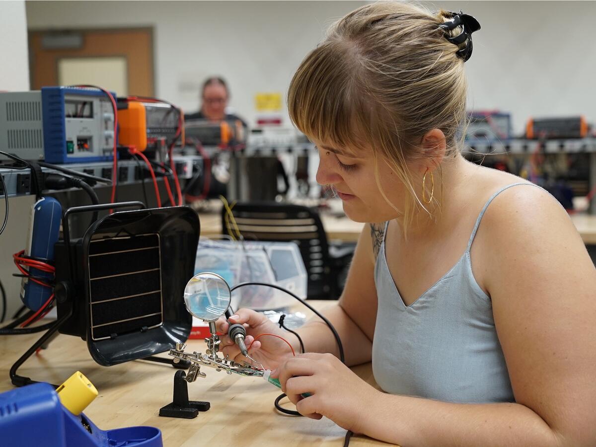 Student working on micro electronics